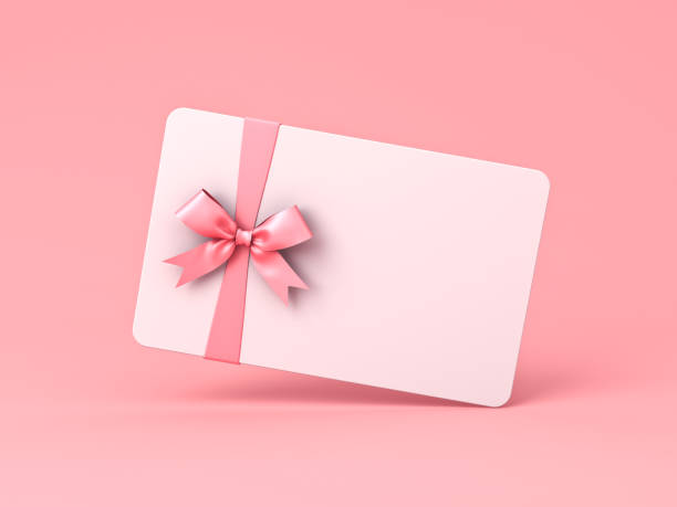 istock White gift card with pink ribbon bow isolated on pink pastel color background with shadow minimal concept 1338763077