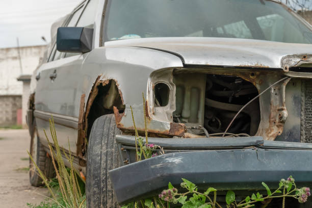 istock Close-up of an old rusty gray car without headlights 1338763342