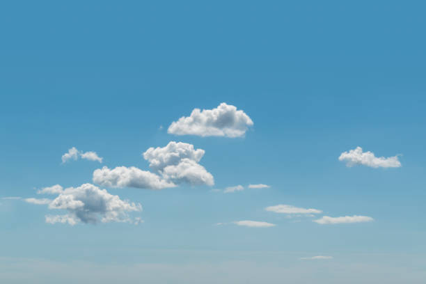 istock Blue summer sky with many white cumulus clouds texture background with copy space for text 1338766864
