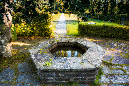 An old wishing well in a cemetery