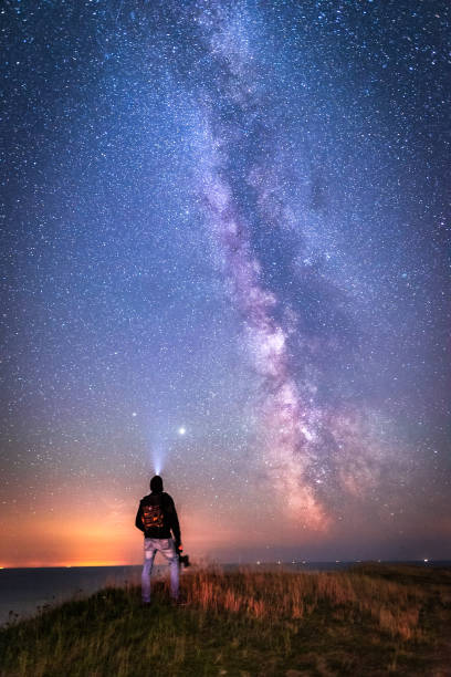 Gazing into the Milkyway Man wonders his place in the universe staring photos stock pictures, royalty-free photos & images