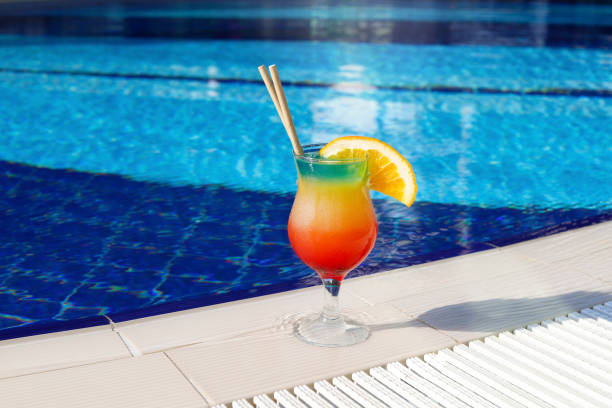 istock Cocktail on the background of the pool 1338769645