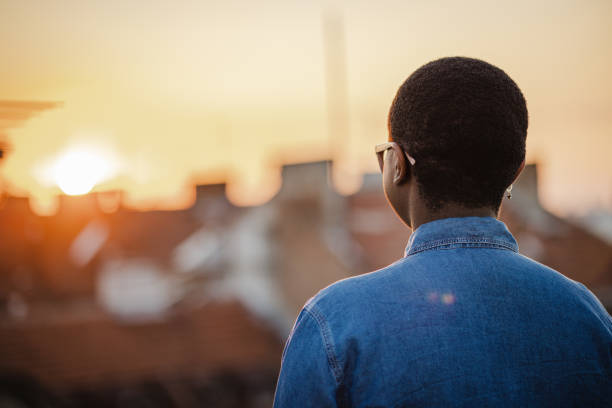 Thinking and contemplation Rear view of a young confident African-American woman looking at the view Pre stock pictures, royalty-free photos & images