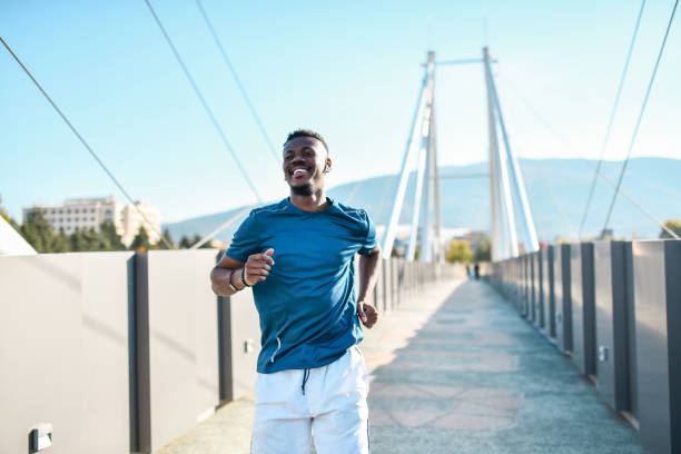 istock Smiling African Male Testing His Endurance Capabilities While Running On Bridge Outside 1338775494