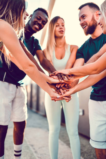istock Smiling Multiethnic Athletes Staying Together Through Tough Exercises Outside 1338775521