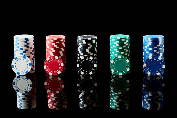 istock Stack of Casino gambling chips isolated on black reflective background 1338777165
