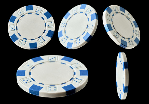 Set of Casino gambling chips isolated on black background.