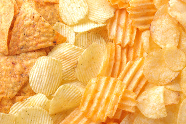 istock Background from different chips close-up. Snacks. unhealthy food. 1338777618