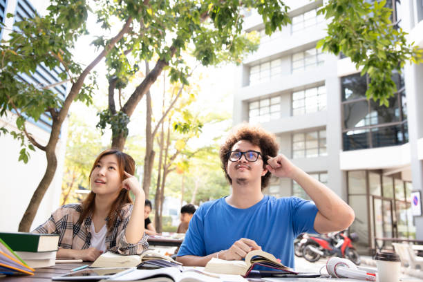 istock Group Student thinking or get good idea after hard studying, lifestyle of student in university 1338780780
