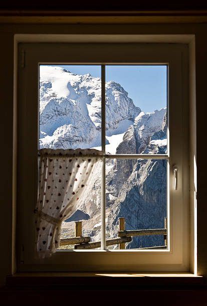 istock Looking the Snowcapped Mountain Through Window 133878306