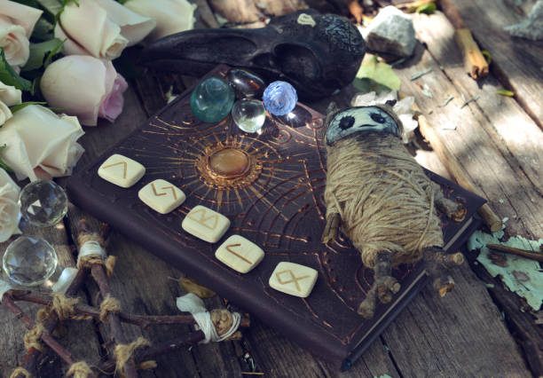 Stack of wooden runes isolated on white background. Runes are cut from wooden blocks. Magic symbols for esoteric divination. The circle of the runes for divination.