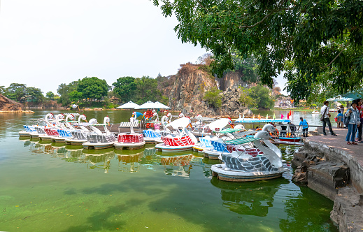 Dong Nai, Vietnam - March 17th, 2019: Swan pier in the ecological garden on a sunny morning, a place for tourists to relax on the largest man-made lake in Dong Nai, Vietnam