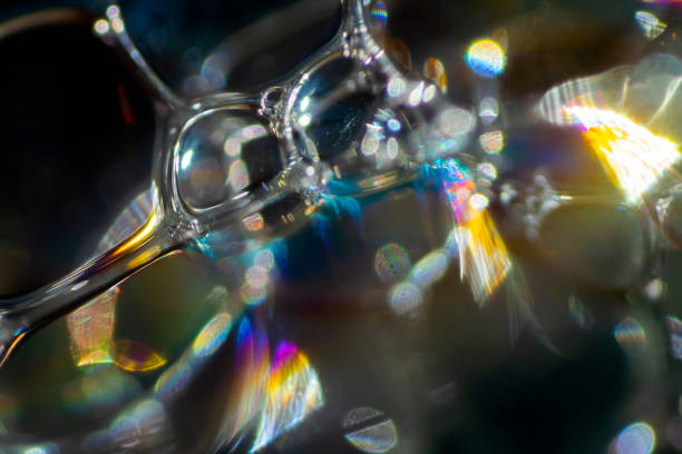 istock View into a microscopic world of soap bubbles, uncovered light, artistic multicolored surreal detail. 1338796988