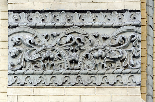 Decorative stucco relief on facade of a building in Kyiv Ukraine.