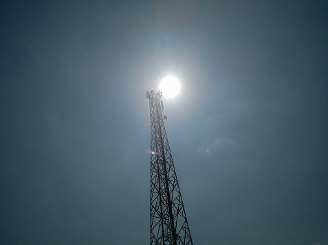 Telecommunications tower with clear sky background