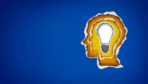 New bright idea as a person with a lightbulb inside representing business success and creativity thinking metaphor in a 3D illustration style.