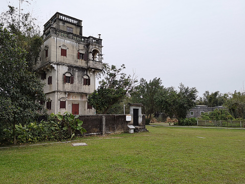 Diaolou at Zilicun village, fortified multi-storey watchtowers that feature the fusion of Chinese and various Western architectural styles and rise up surrealistically over the rice paddy fields. They are located in Kaiping, Jiangmen prefecture, Guangdong province, China.