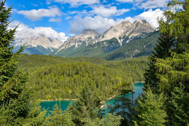 istock Scenic mountains and emerald lake panorama landscape 1338801088