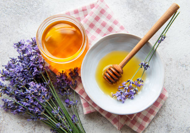istock Jar with honey and fresh lavender flowers 1338802231