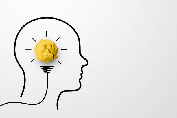 istock Creative thinking ideas and innovation concept. Paper scrap ball yellow colour with light bulb and head human symbol on white background 1338803165