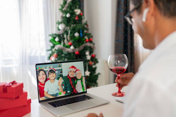 istock Man Having A Christmas Video Call With His Family 1338803588
