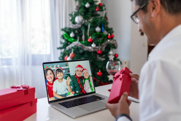 istock Man Having A Christmas Video Call With His Family 1338804510