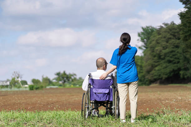 istock Elderly and caregivers looking at the fields 1338805090