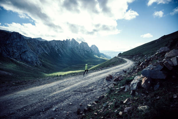 istock Woman trail runner running on mountain top 1338806168