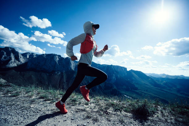 istock Young woman ultramarathon runner running at mountain top 1338806189