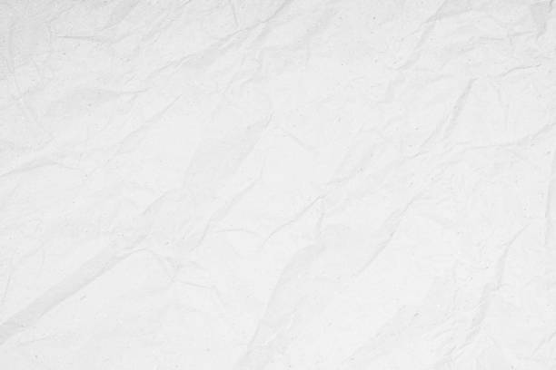 istock White recycled craft paper texture as background. Grey paper texture, Old vintage page or grunge vignette of old newspaper. Pattern rough art creased grunge letter. Hardboard with copy space for text. 1338807258