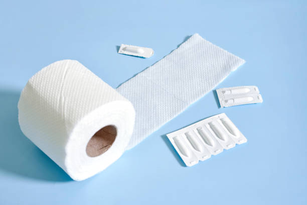 istock Toilet paper roll and hemorrhoidal suppositories 1338807335