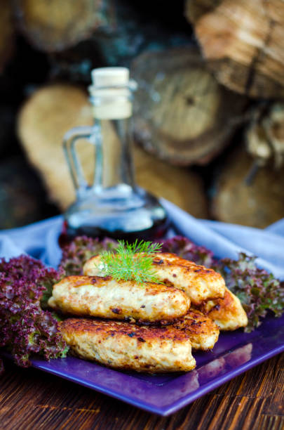 istock Chicken cutlets on a plate with lettuce 1338808257
