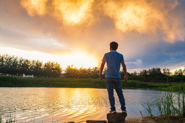 Men enjoy the beautiful scenery in the sunset
