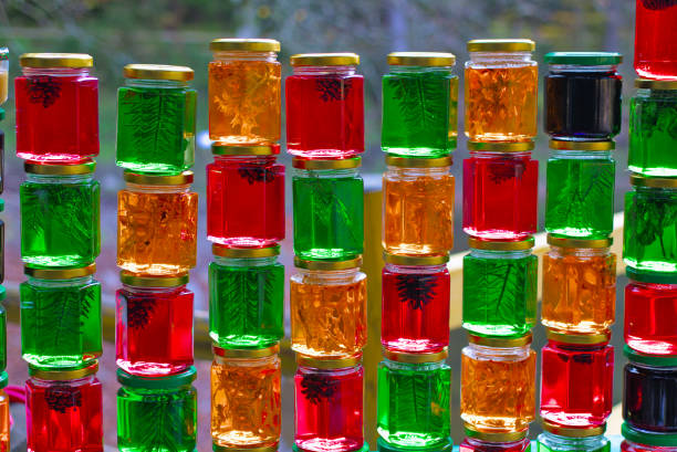 istock A set of small jars of different colors with jam without labels. 1338809936