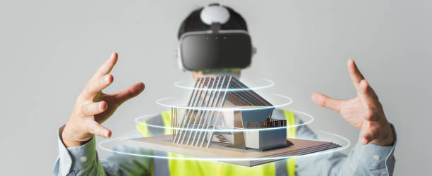 Architect or Engineer use VR headset for BIM technology working design 3D house model in building complete. Architect or Engineer designer wearing VR headset for BIM technology working design 3D house model in building complete. building information modeling photos stock pictures, royalty-free photos & images