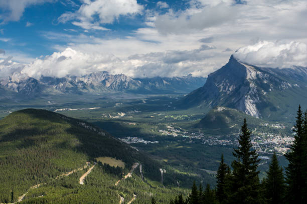 istock beautiful mountain peaks, blue sky and clouds. Canadian mountains, clouds 1338810368