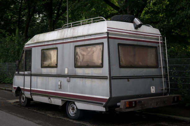 istock old vintage camper van parked on the street from behind 1338812230