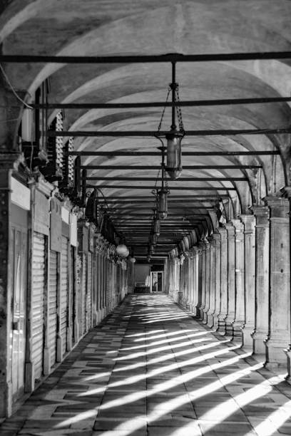istock shadow at the colonnades at St. Mark's square in Venice 1338812237