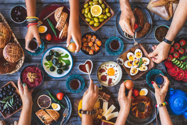 istock Many hand sharing and eating their food. 1338812326