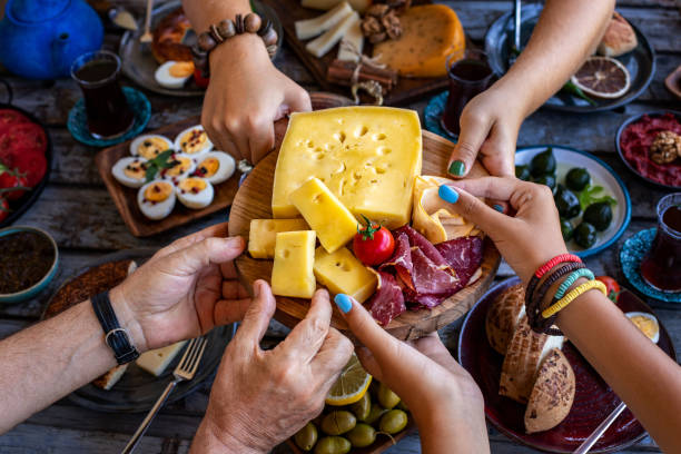 istock Many hand sharing and eating their food. 1338812327