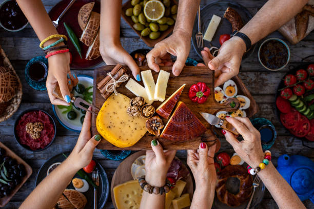 istock Many hand sharing and eating their food. 1338812328