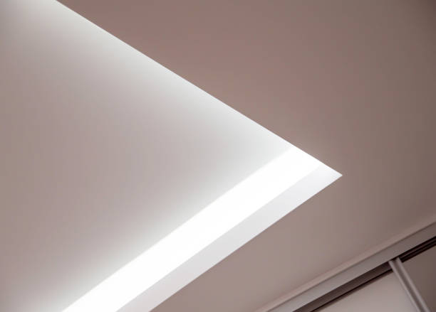 istock Parts of a designer stretch ceiling with diode lighting. Modern ceiling renovation, interior 1338813330