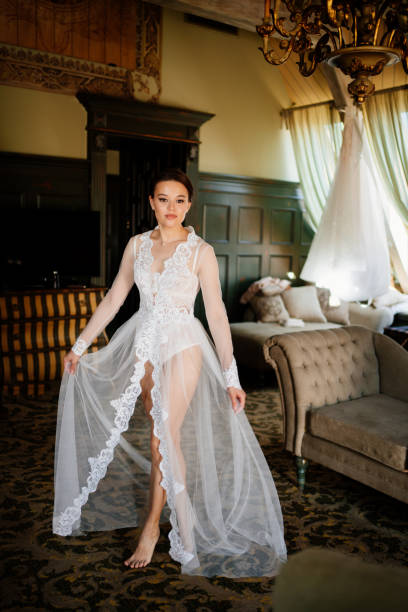 istock a beautiful bride in a lace robe in a room with a retro interior. 1338815498
