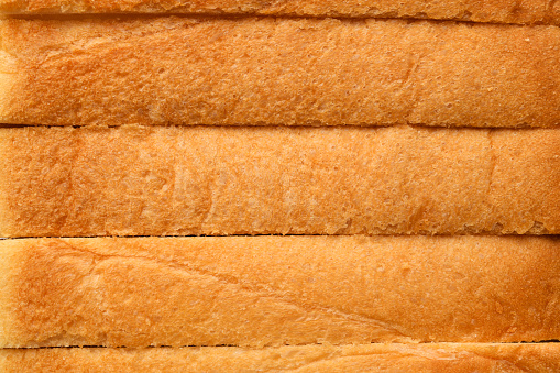 Extreme close-up of stacked five bread crusts.