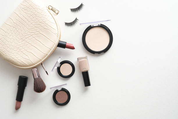 istock Make-up bag with cosmetics and accessories on white background. Flat lay, top view. 1338818907