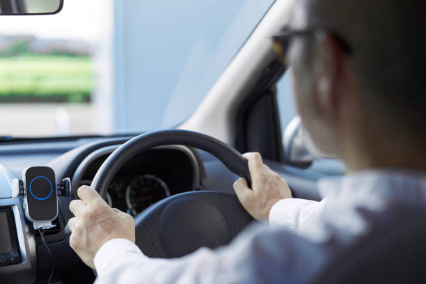 istock Back view of an elderly person driving a car 1338820691