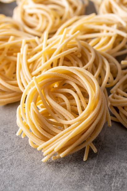 istock Italian pasta nest. Uncooked spaghetti nest. 1338821930