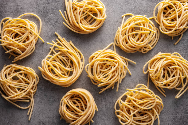 istock Italian pasta nest. Uncooked spaghetti nest. 1338821931