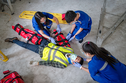 Emergency medical teams are First aid for injuries in work accidents. Using first aid equipment support to loss of feeling or loss of normal movement and Loss of function in limbs, First aid training to transfer patient.