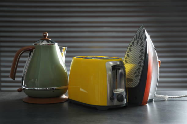 istock Set of modern home appliances on grey table 1338822428